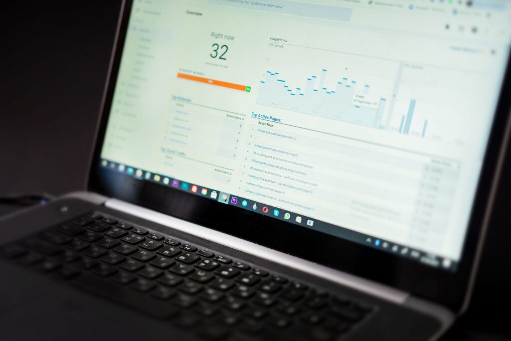 Laptop displaying an analytics dashboard with charts